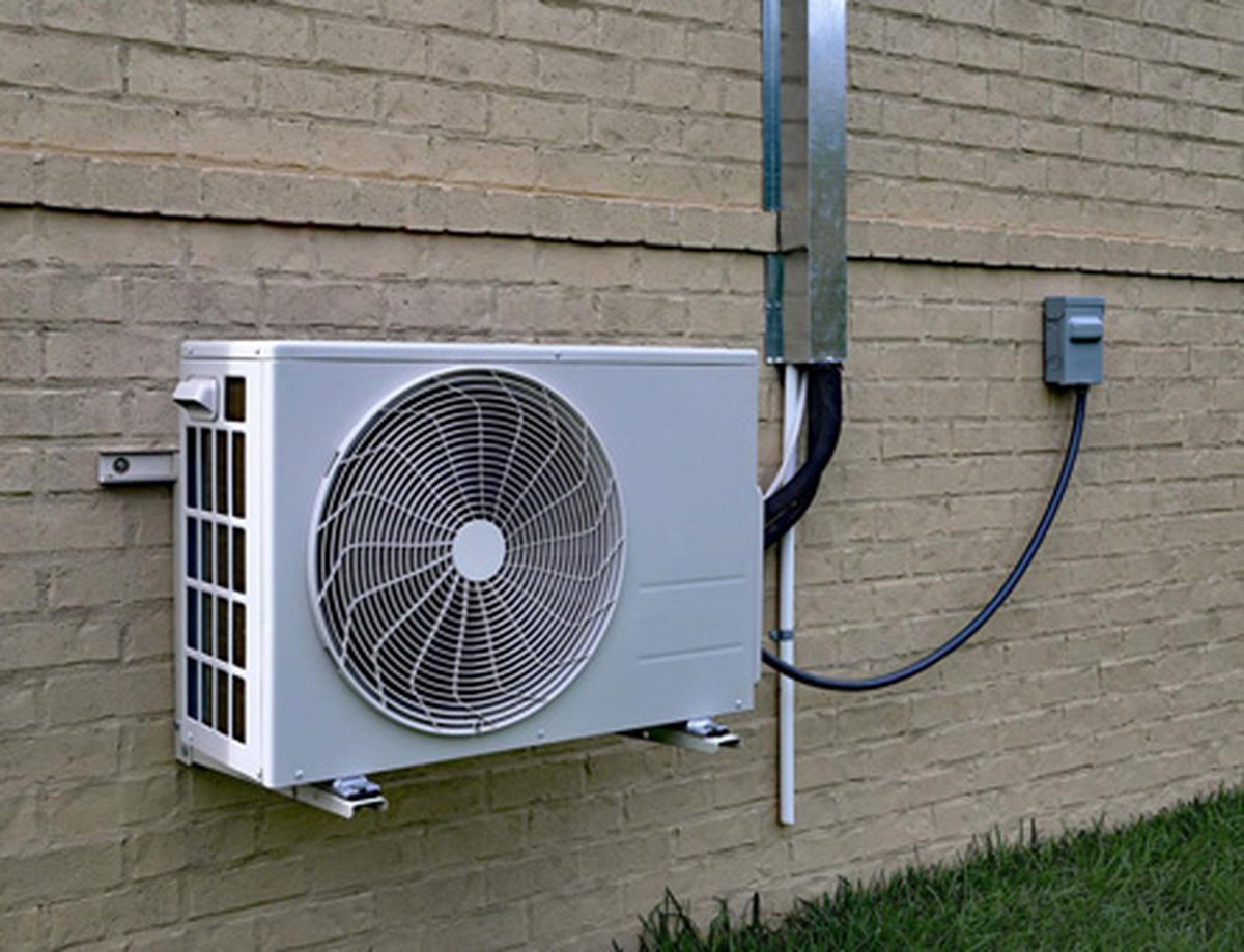Split system outdoor unit on a brick wall