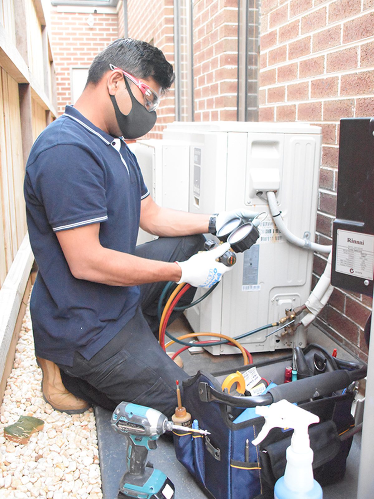 Technician commissioning a split system outdoor unit