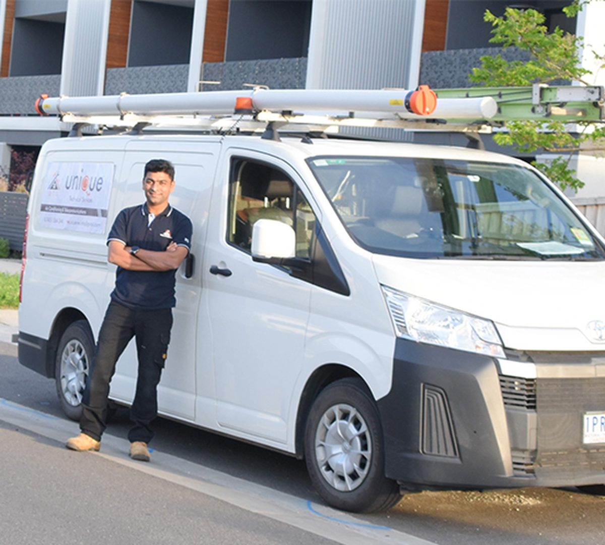 Somnath, owner of Unique Technical Services, with the work van